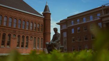 a statue in front of a building