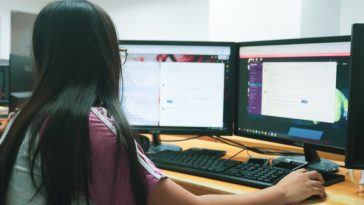 woman using desktop computer