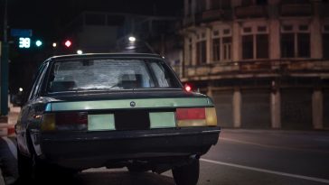 black car parked on road