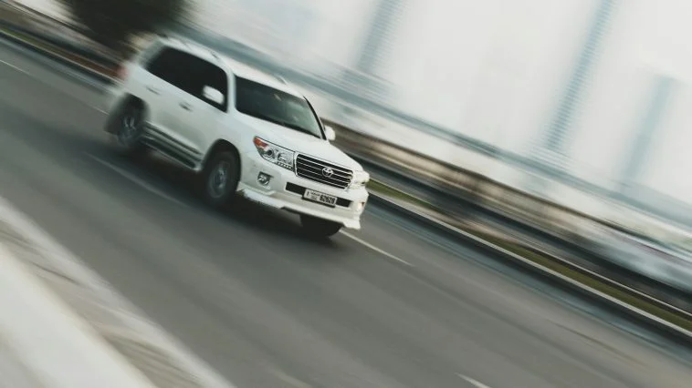 time lapse photography of white sport utility vehicle